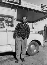 Roger Talbot in front of his father's service station